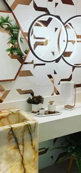 Lavabo com cuba esculpida em ônix iluminado
